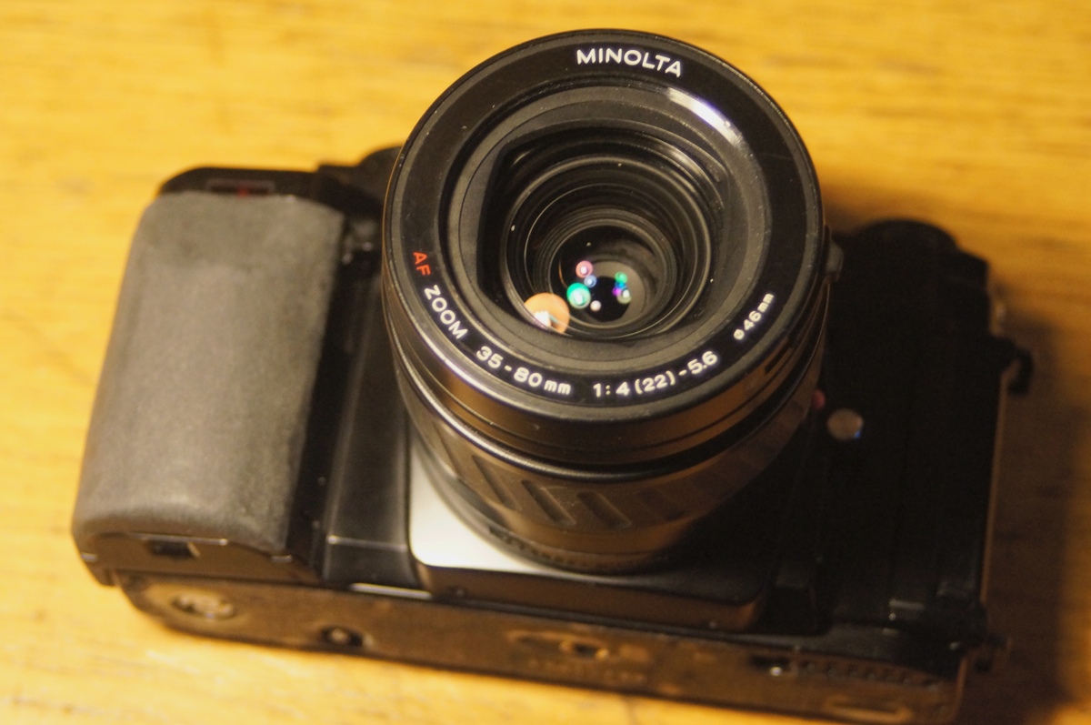 photo of the working camera, with the aperture stopped part way. that handgrip was rebuilt with sugru and not completely perfect, but i've learned from past mistakes in that I should really just accept good enough with that stuff. 