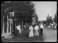 Friends-on-Street-Infront-of-Flag copy.jpg