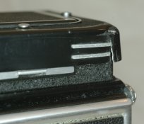 Rollei E1 focus hood dent.jpg Rollei E1 focus hood dent.jpg