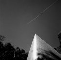 sculpture and jet trail