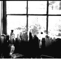 bottles in the garage window