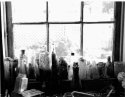 Print of Bottles in the window