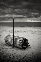 Rolled up beach fence