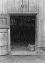 Bucket in Barn Door