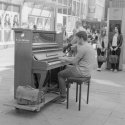 Piano player in shopping street