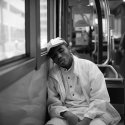 Boy Sleeping on Bus