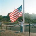 Lowering the flag.