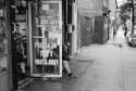 Sitting in Front of a Bodega After the Rain