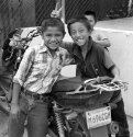 Three boys and a motorcycle