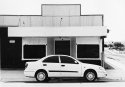 Car in front of Shop