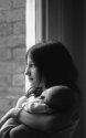 Daughter holding son
