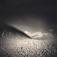 Sea wall and passing clouds