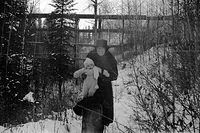 Mum and kid in snow, 1920's.jpg