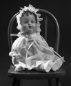 Doll on chair