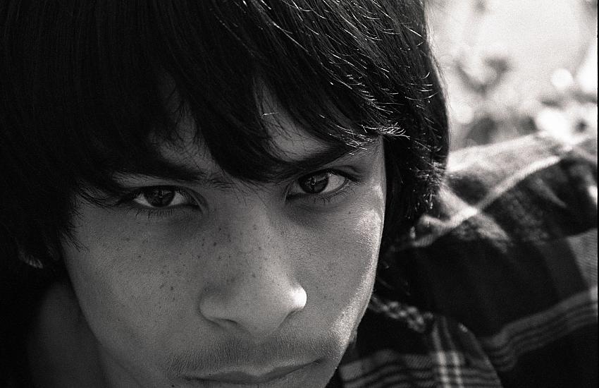 A boy annoyed by a camera