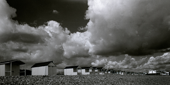 Beach Huts with approaching storm.