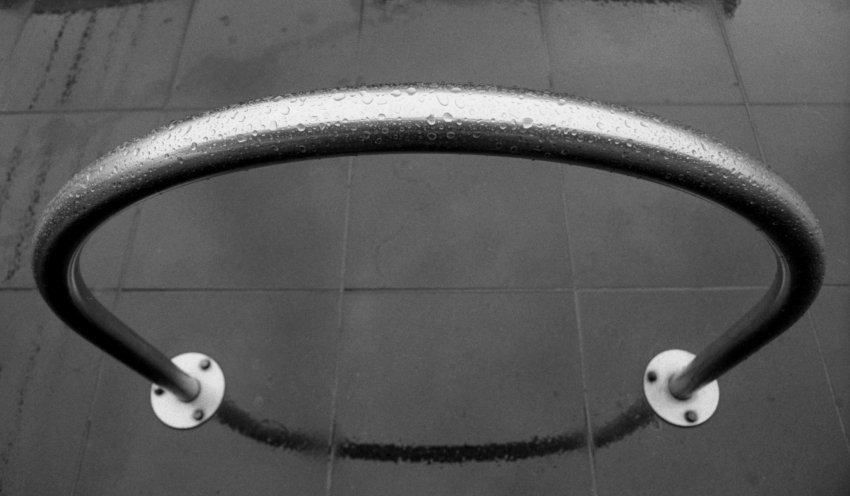 Bike rack on wet pavement