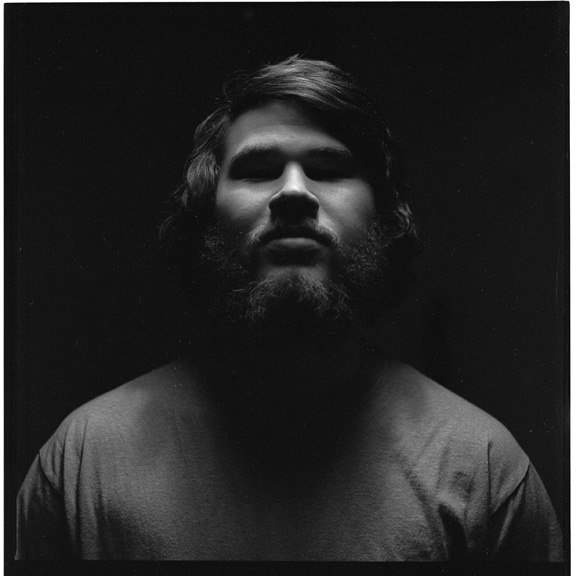 By the beard.