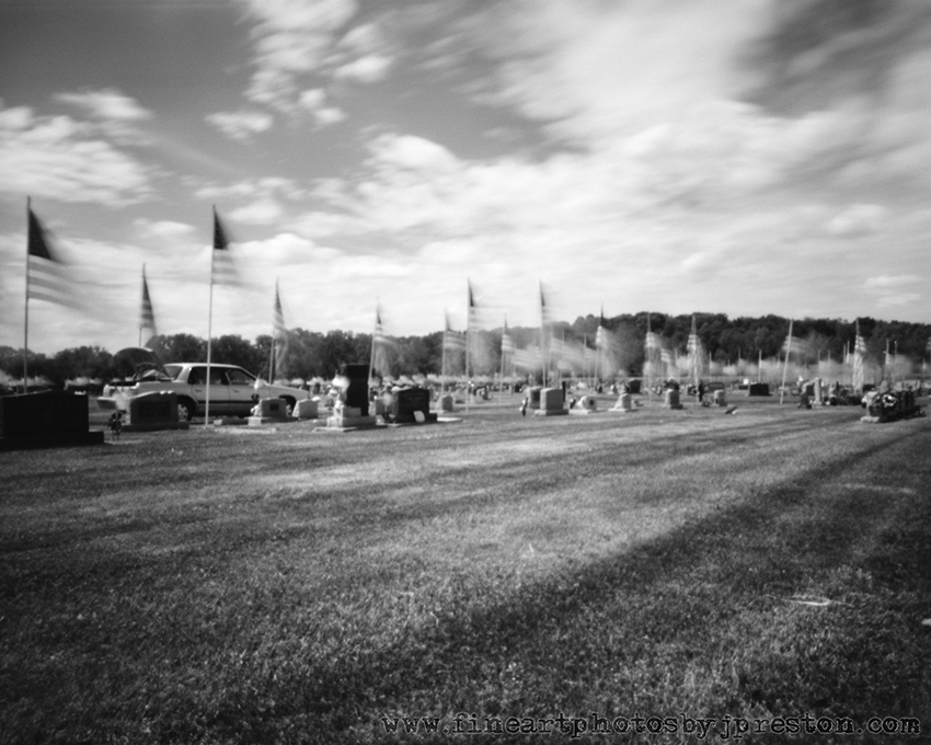 Cemetary With Large Flags Apug