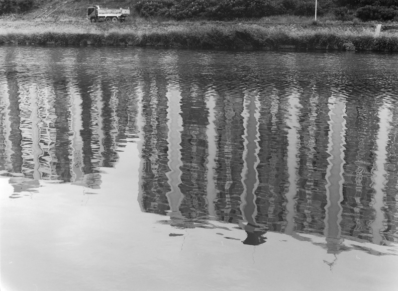 Dump Truck and Apartment Reflection