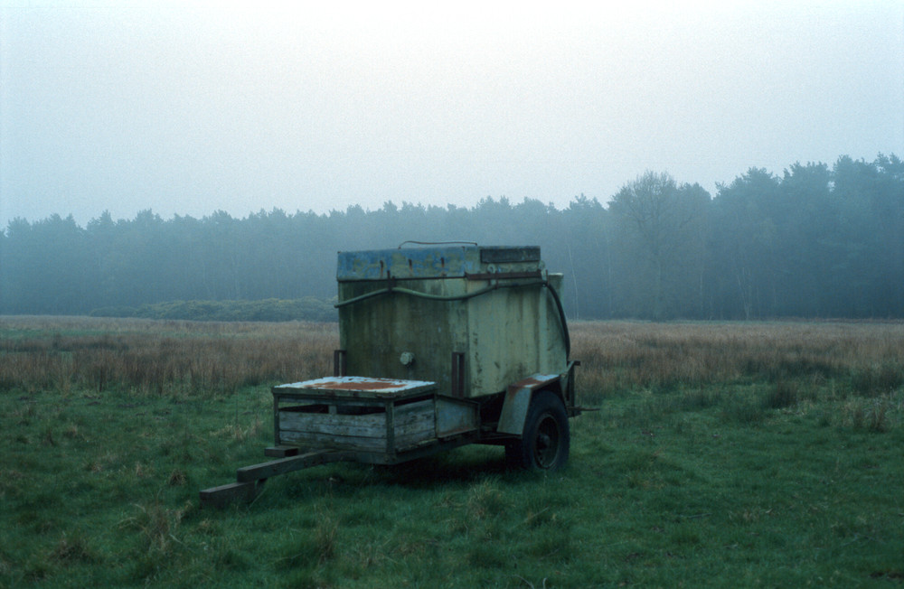 Farm equipment in the mist.