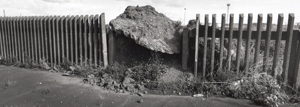 fence and boulder