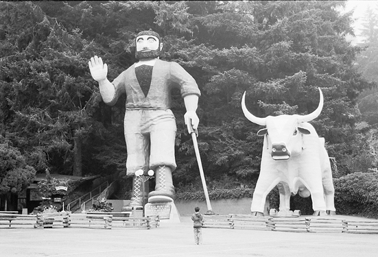 Little boy and big blue oxe