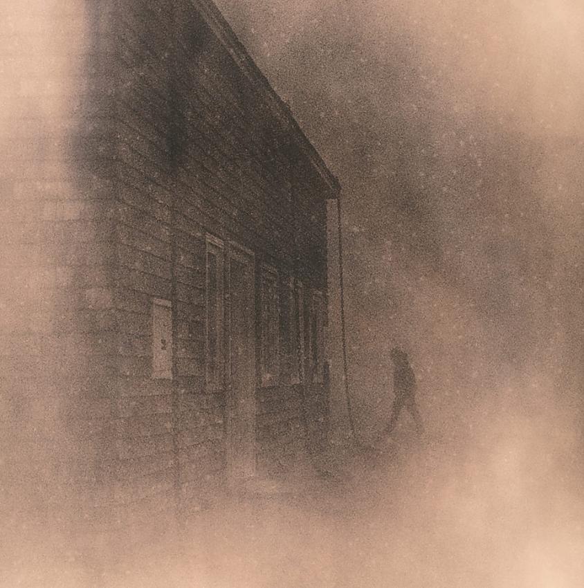 Man Walking in Mountain Clouds