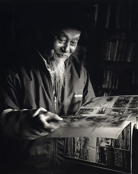 Mr. Dong with his scrapbook