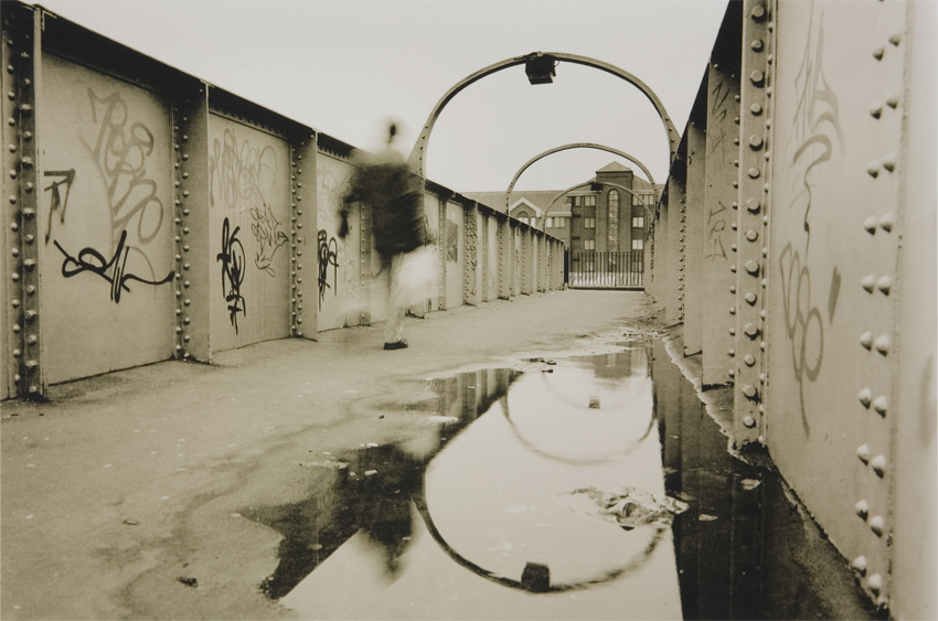 Puddley graffitied bridge