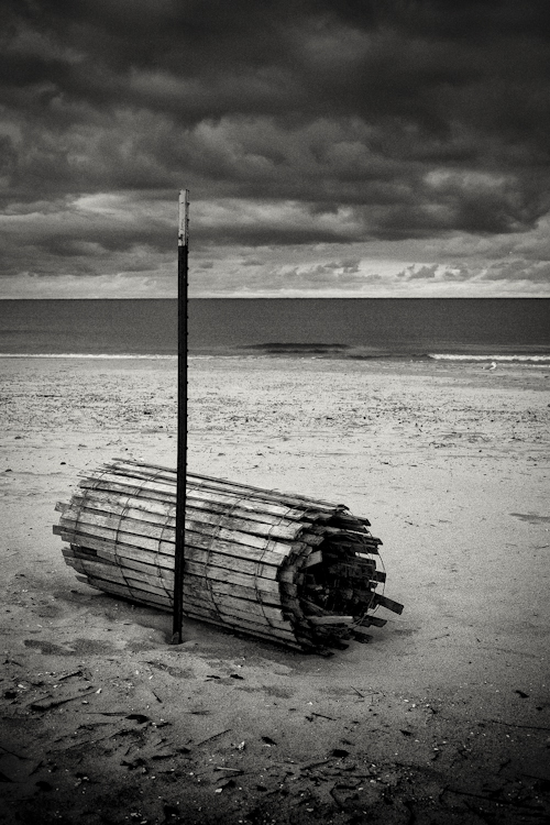 Rolled up beach fence