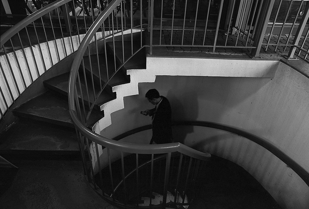 Spiral Stairs, Man on Phone