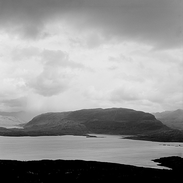 Standing in a bog, looking out on a loch.