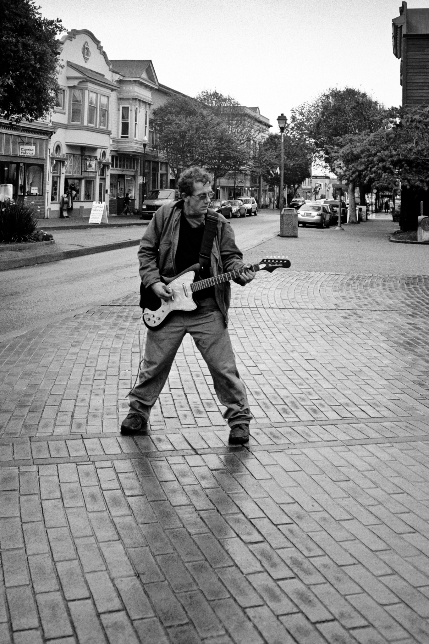 Street musician on a rainy day