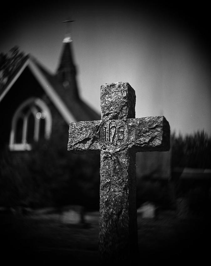 Tomb and old wooden church
