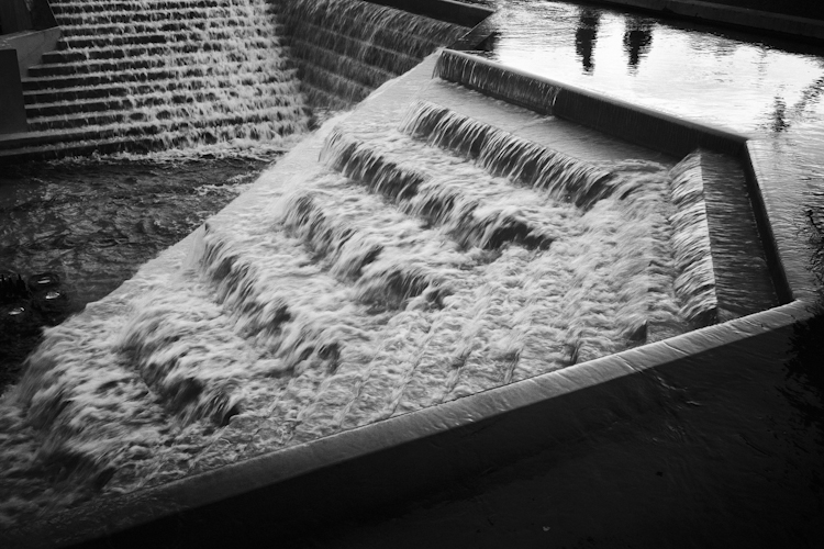 Two People Observing Fountain