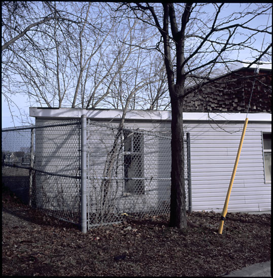 yard with fence and guy wire